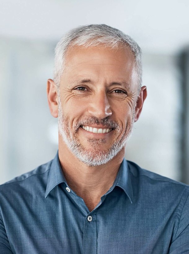 A man smiling confidently